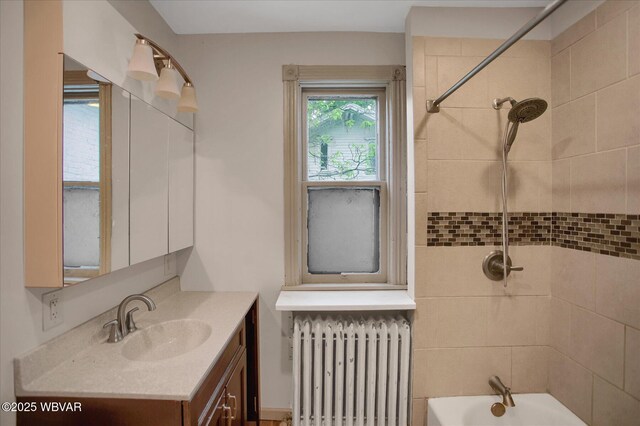 330 High St, Williamsport, PA 17701 - full bathroom featuring radiator, vanity, and tub / shower combination