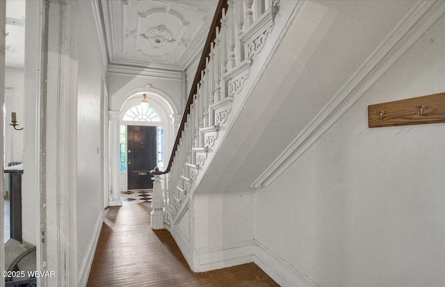 330 High St, Williamsport, PA 17701 - corridor featuring ornamental molding, dark wood-type flooring, stairs, and baseboards