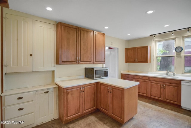 330 High St, Williamsport, PA 17701 - kitchen featuring stainless steel microwave, a sink, a peninsula, dishwasher, and light countertops