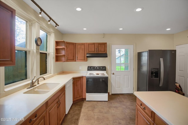 330 High St, Williamsport, PA 17701 - kitchen with range with electric stovetop, stainless steel fridge, under cabinet range hood, a sink, and white dishwasher