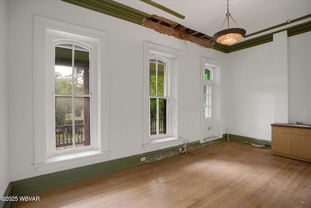 330 High St, Williamsport, PA 17701 - spare room with healthy amount of natural light, light wood finished floors, and baseboards