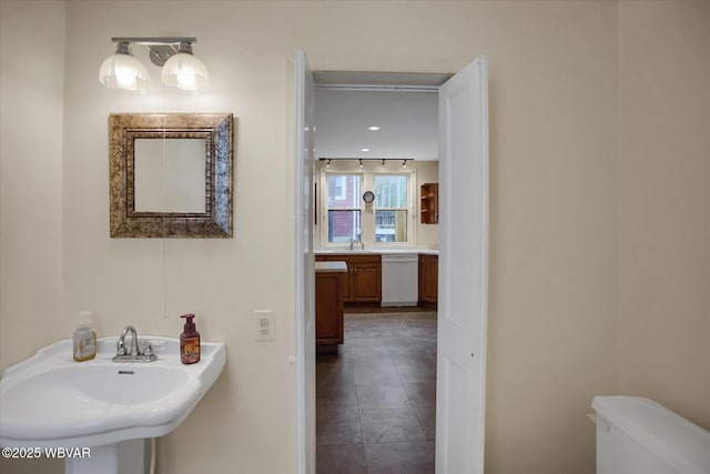 330 High St, Williamsport, PA 17701 - bathroom with a sink, toilet, and tile patterned floors
