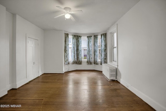 330 High St, Williamsport, PA 17701 - spare room featuring radiator, a ceiling fan, hardwood / wood-style floors, and baseboards