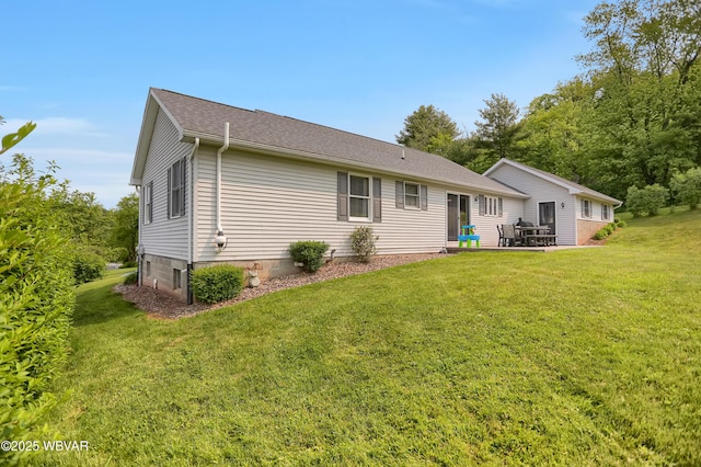 262 Walnut Ln, Jersey Shore, PA 17740 - back of property with a lawn, a patio area, and a shingled roof