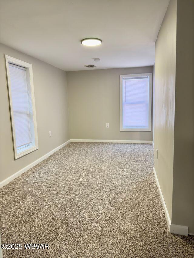 view of carpeted spare room