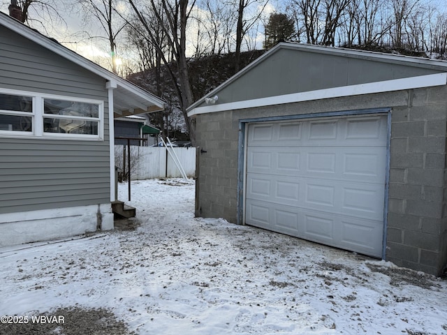 view of snow covered garage