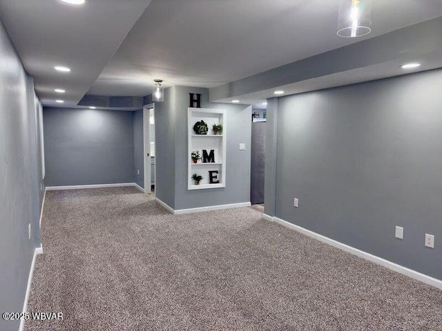 basement with carpet floors and built in shelves