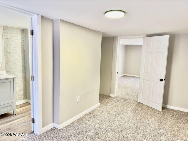 empty room featuring light carpet