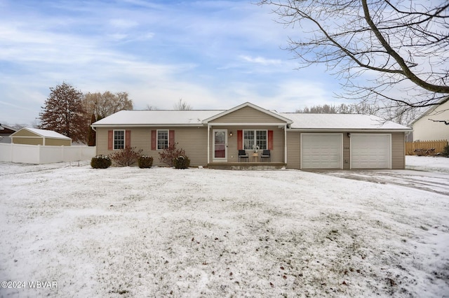 single story home with a porch and a garage