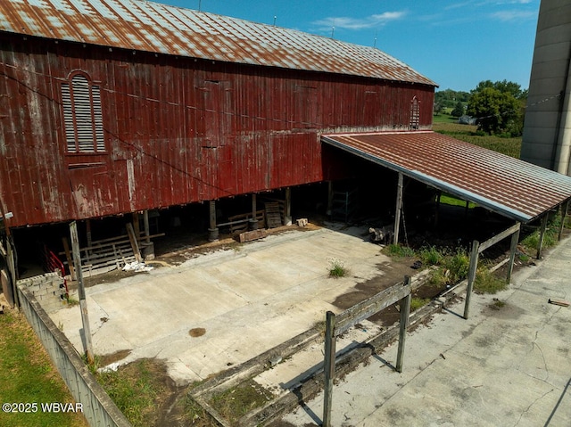 view of home's exterior featuring an outbuilding