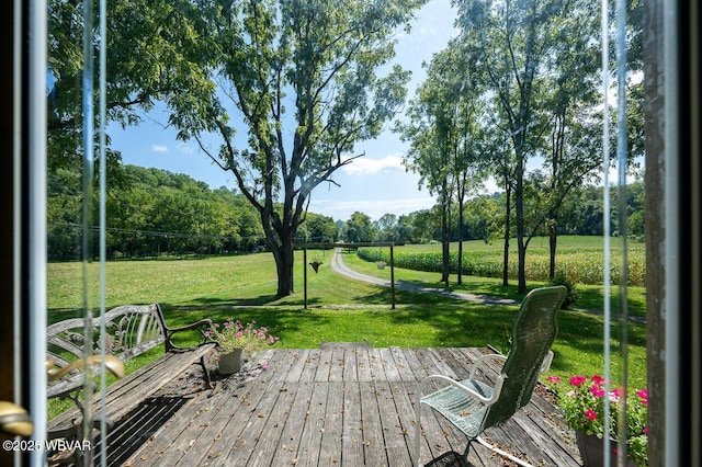 view of community featuring a lawn and a deck