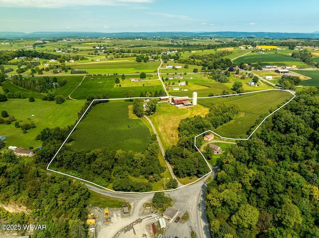 birds eye view of property featuring a rural view