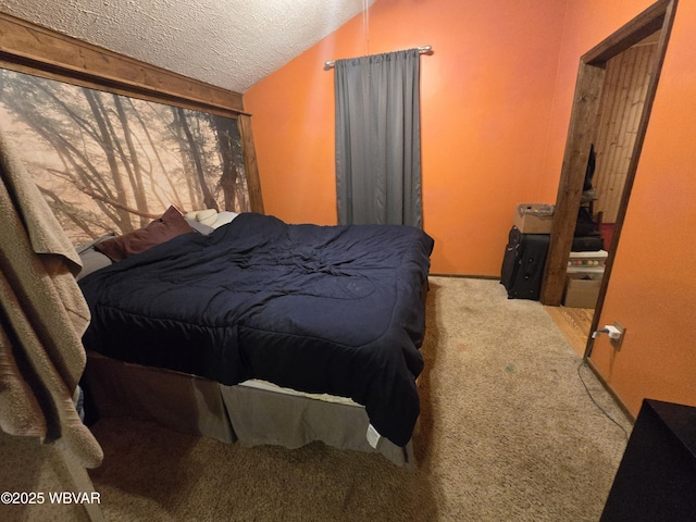carpeted bedroom featuring a textured ceiling and vaulted ceiling