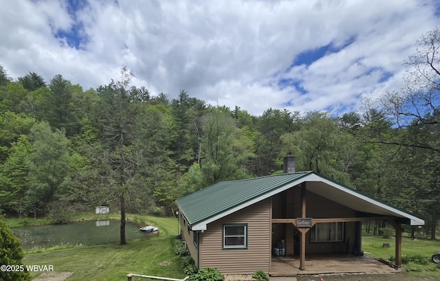 exterior space with a wooded view