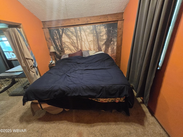 carpeted bedroom featuring a textured ceiling