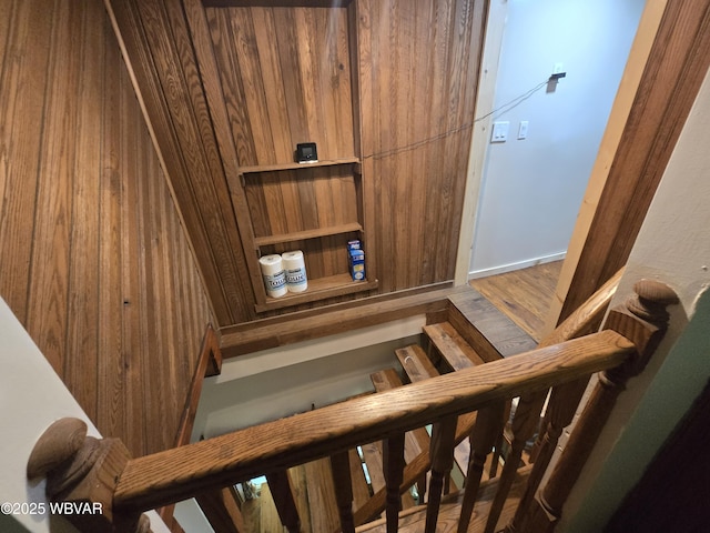stairway with wood finished floors