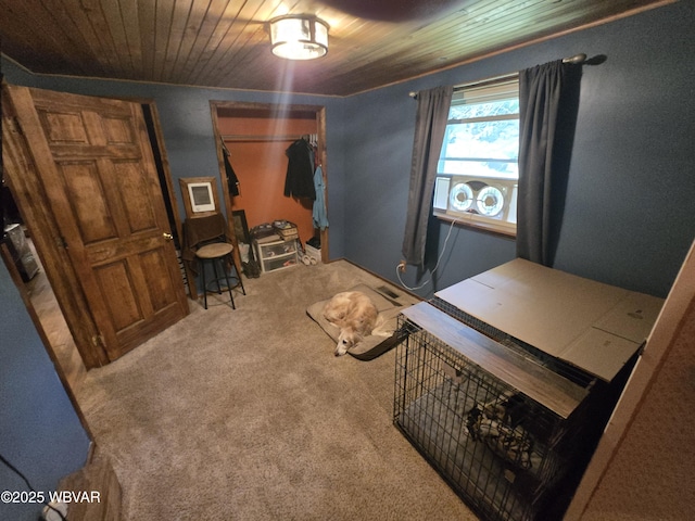 carpeted bedroom with wooden ceiling