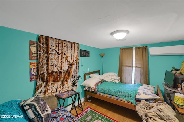 522 S Main St, Jersey Shore, PA 17740 - bedroom featuring wood finished floors and a wall unit AC