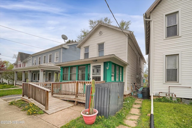 522 S Main St, Jersey Shore, PA 17740 - rear view of house with a sunroom