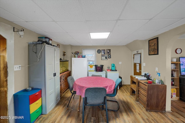 522 S Main St, Jersey Shore, PA 17740 - dining room featuring wood finished floors, a paneled ceiling, and arched walkways