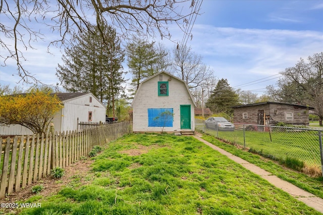 522 S Main St, Jersey Shore, PA 17740 - rear view of house with fence, entry steps, a gambrel roof, and a lawn