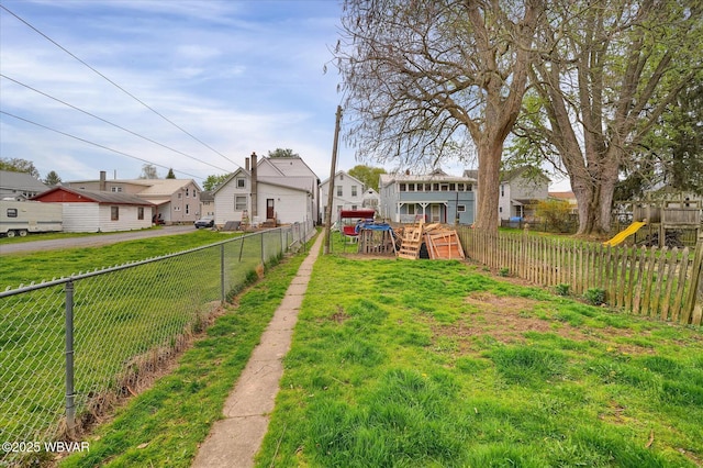 522 S Main St, Jersey Shore, PA 17740 - view of yard with a residential view, a wooden deck, a playground, and a fenced backyard