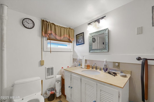 522 S Main St, Jersey Shore, PA 17740 - bathroom with heating unit, toilet, and vanity