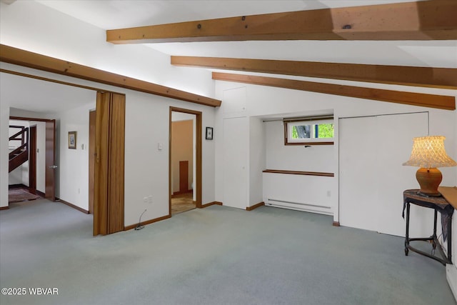 below grade area with carpet flooring, baseboards, and baseboard heating