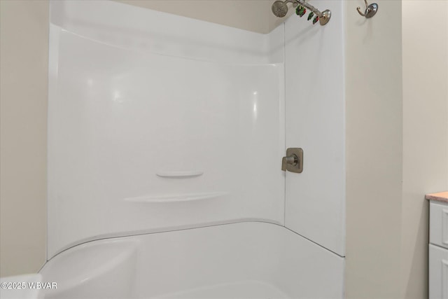 full bath featuring vanity and walk in shower