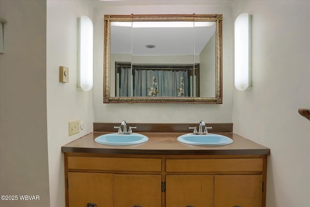 bathroom with double vanity and a sink