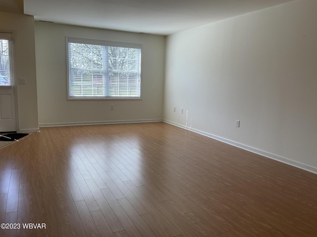 unfurnished room featuring hardwood / wood-style floors