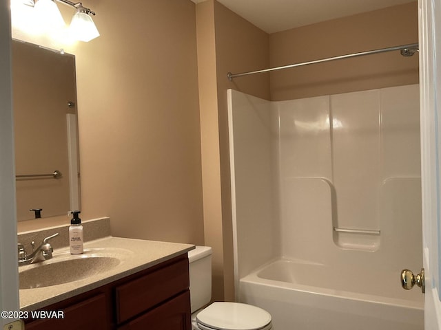 full bathroom featuring vanity, toilet, and tub / shower combination