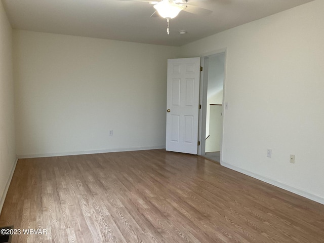 unfurnished room with ceiling fan and light hardwood / wood-style flooring