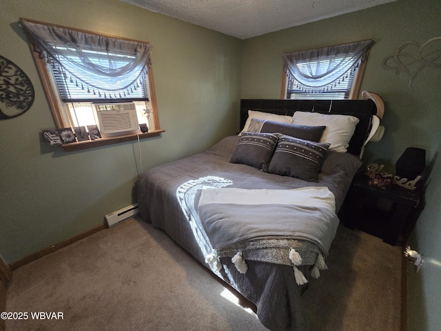 bedroom featuring baseboard heating, carpet flooring, multiple windows, a textured ceiling, and cooling unit