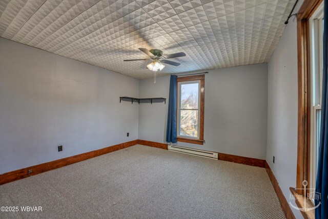 unfurnished room featuring carpet flooring, ceiling fan, and a baseboard heating unit