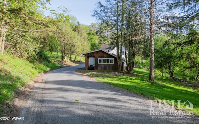 view of front of house featuring an outbuilding