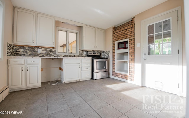 kitchen with stainless steel range with electric stovetop, white cabinetry, light tile patterned floors, and backsplash