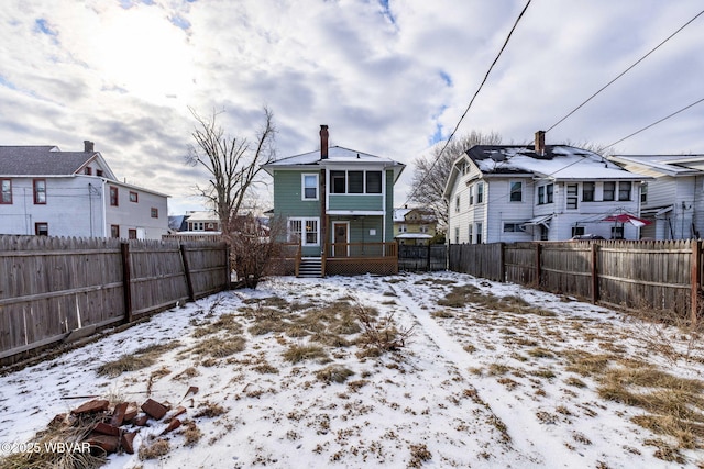 1206 Park Ave, Williamsport, PA 17701 - snow covered house featuring a residential view, a chimney, and a fenced backyard