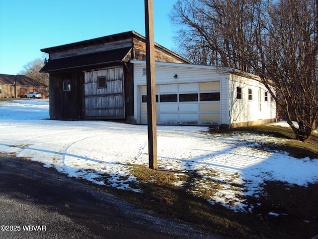 view of snow covered garage