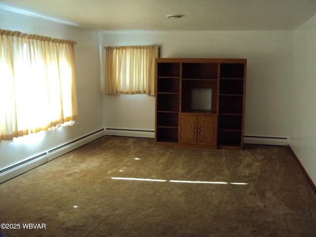 unfurnished living room with baseboard heating and dark colored carpet