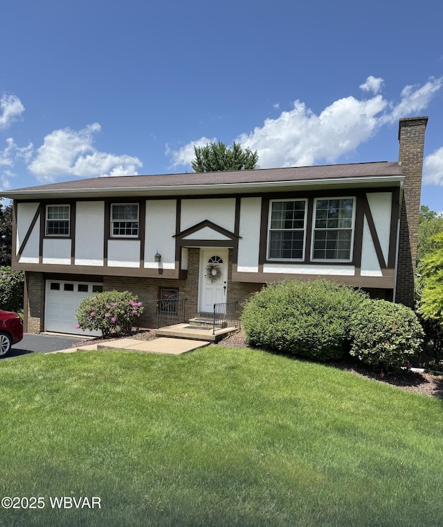 301 Charles Rd, Muncy, PA 17756 - view of front of property featuring a garage, stucco siding, a front lawn, brick siding, and a chimney