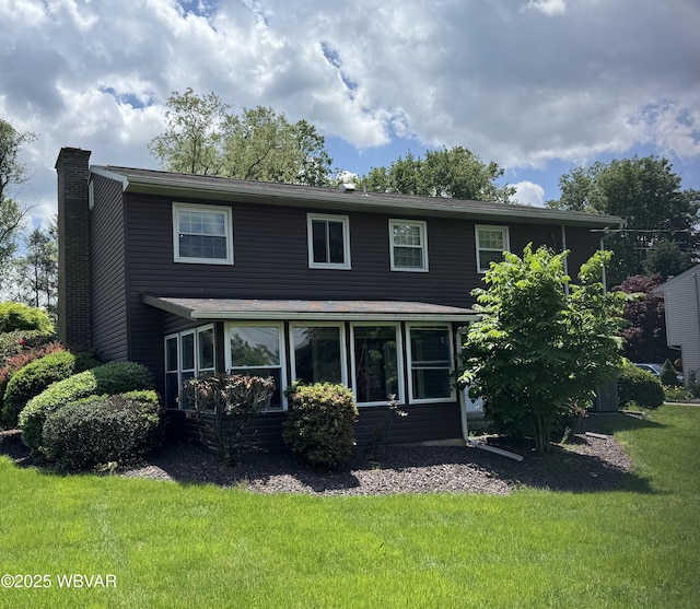 301 Charles Rd, Muncy, PA 17756 - view of front of home with a chimney, a sunroom, and a front lawn