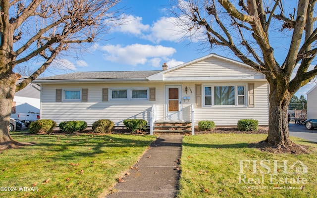 ranch-style home with a front yard