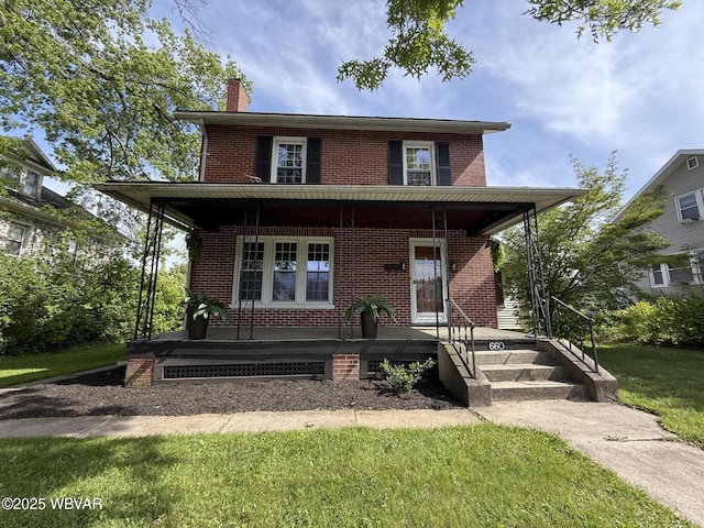 660 Bellefonte Ave, Lock Haven, PA 17745 - view of front of property featuring a porch, brick siding, a chimney, and a front lawn