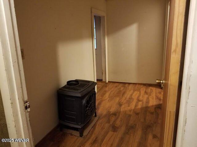 hallway with wood finished floors