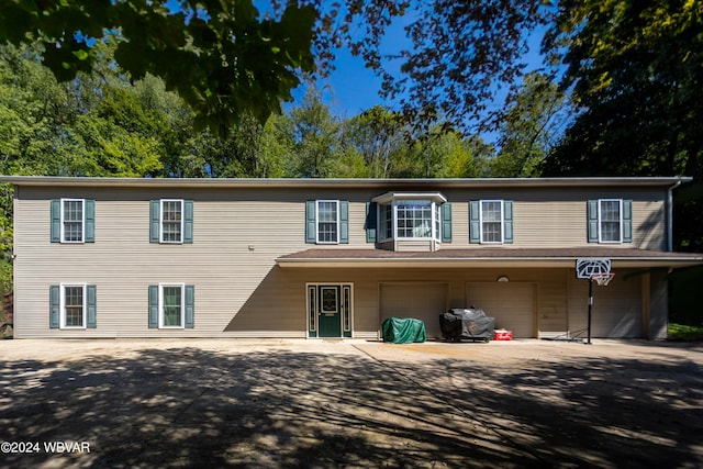 front of property with a garage