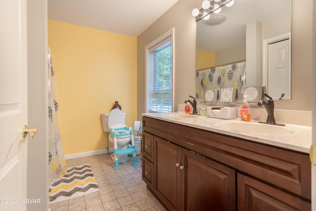 bathroom featuring tile patterned floors and vanity