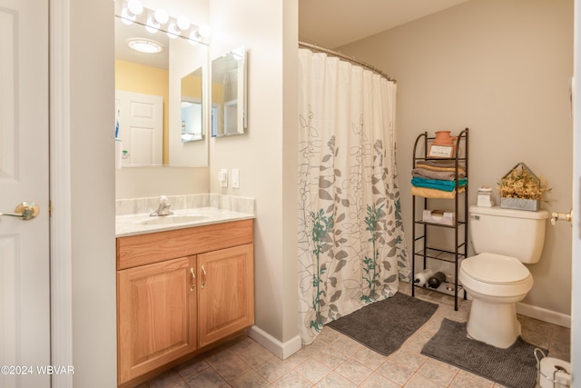 bathroom featuring a shower with shower curtain, tile patterned floors, vanity, and toilet