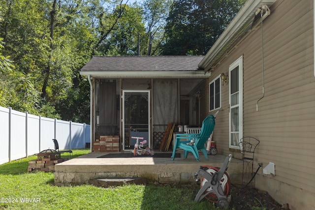 view of patio featuring a sunroom