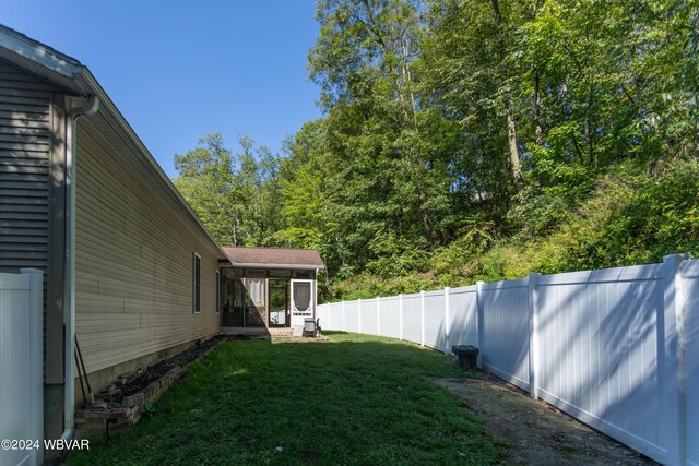 view of yard featuring a sunroom